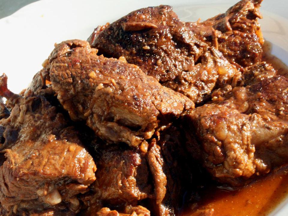 Close up view of Boneless Short Ribs on a white platter