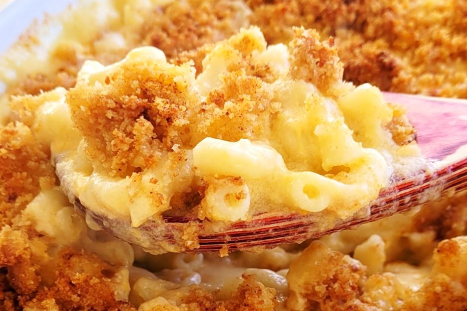 Close up view of a spoonful of homemade mac and cheese