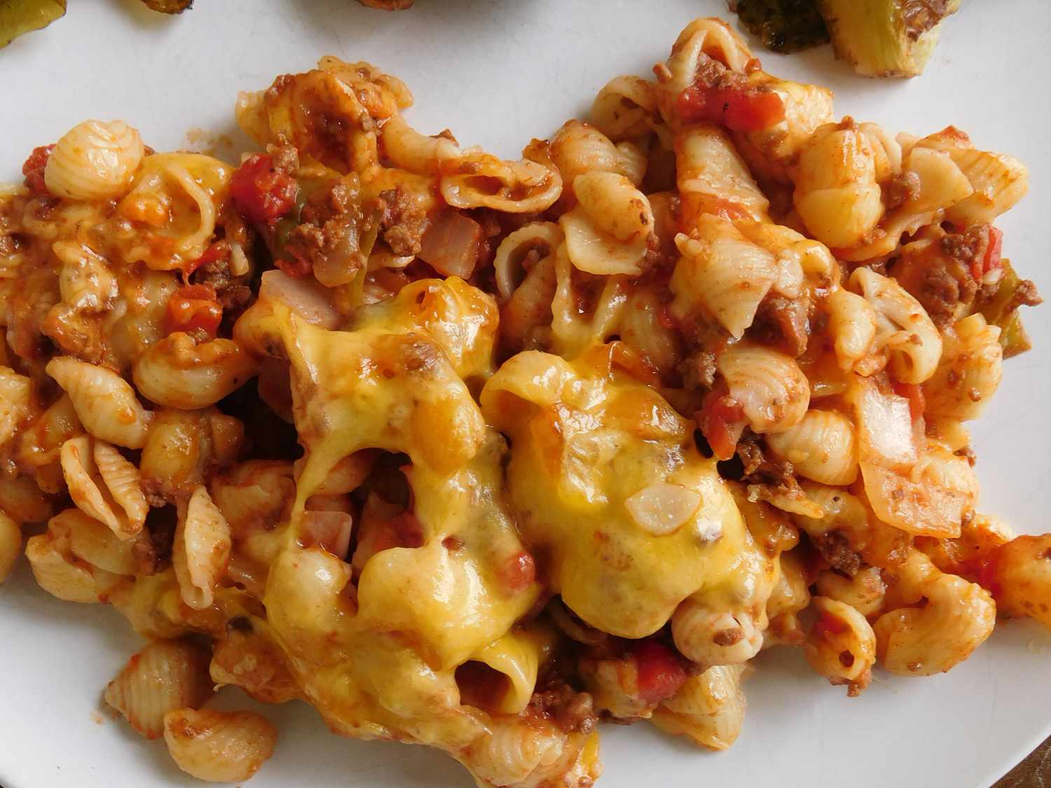 Closeup of macaroni casserole on white plate