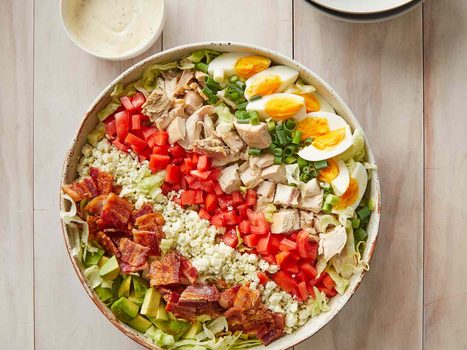  overhead angle looking down at a large bowl of cobb salad