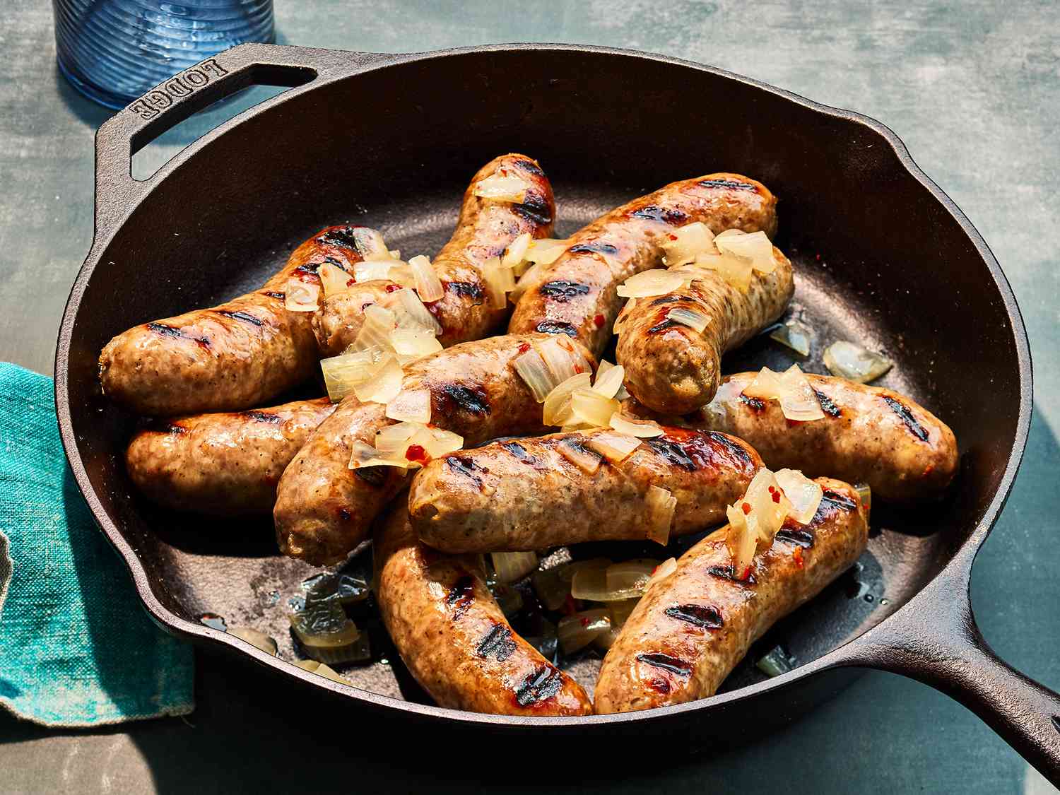 Cooked beer brats on a skillet. 