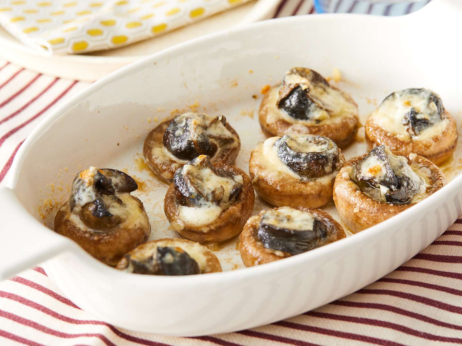 Close up on a baking dish of garlic escargots