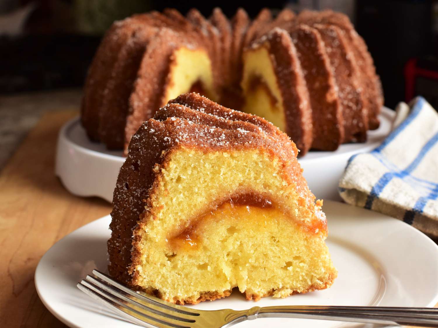 Slice of Bundt cake with a ribbon of apricot jam in the center