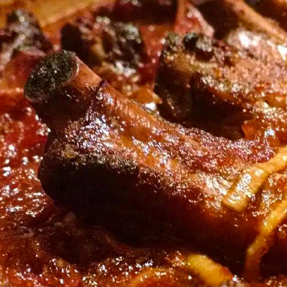 Close up view of Oven Baked BBQ Ribs in a baking dish