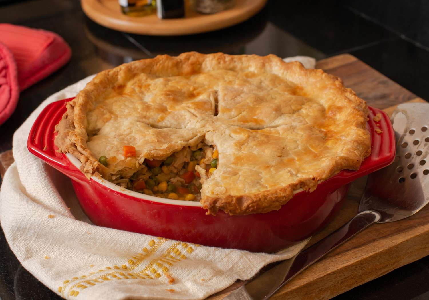 Low angle looking into a turkey pot pie with a slice out