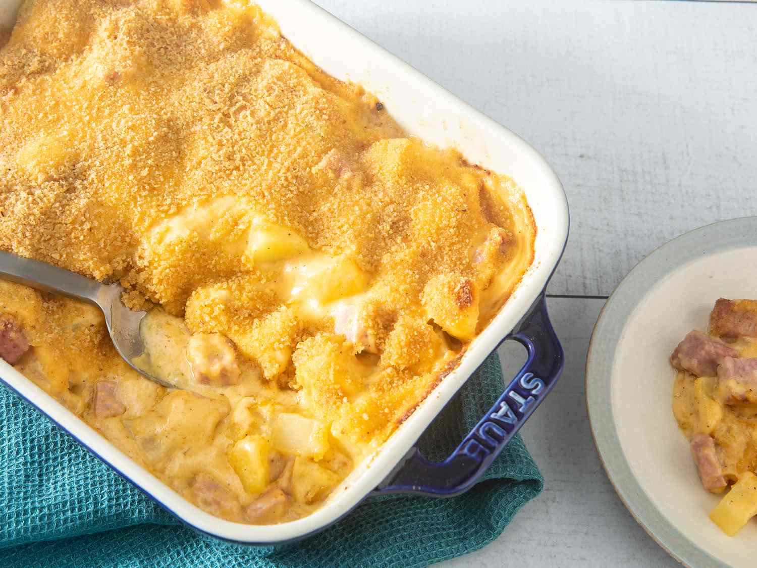 Overhead view of ham-n-potato casserole served in a casserole dish.