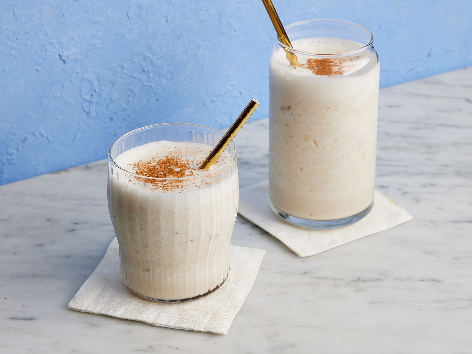 Close up of two glasses of banana milkshake with straws