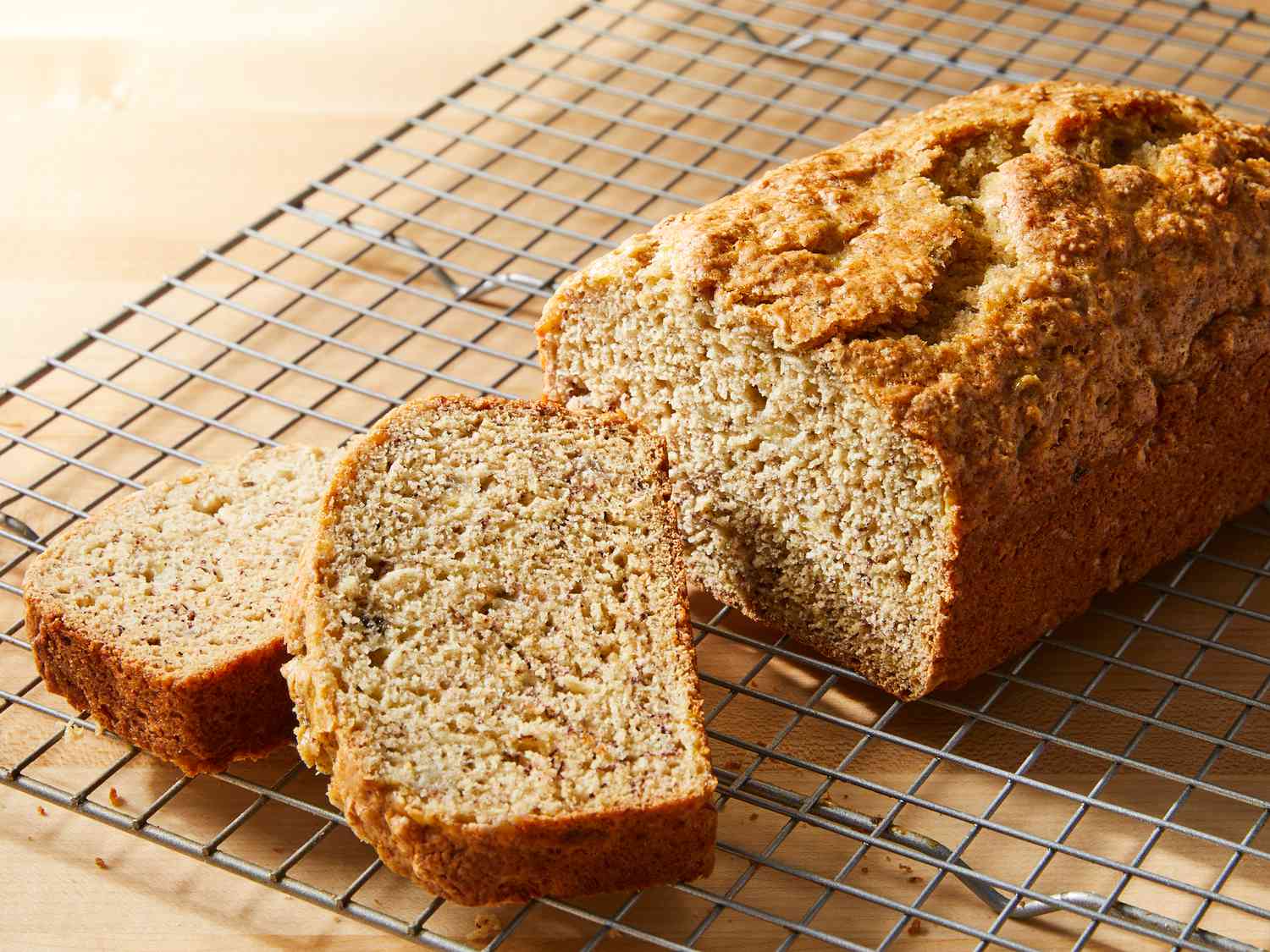 Close up on a loaf of almost no fat banana bread with two slices cut