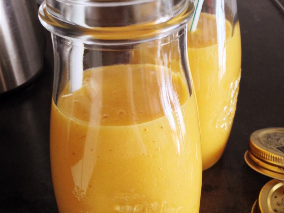 Close up view of Protein Mango Smoothies in glass bottles