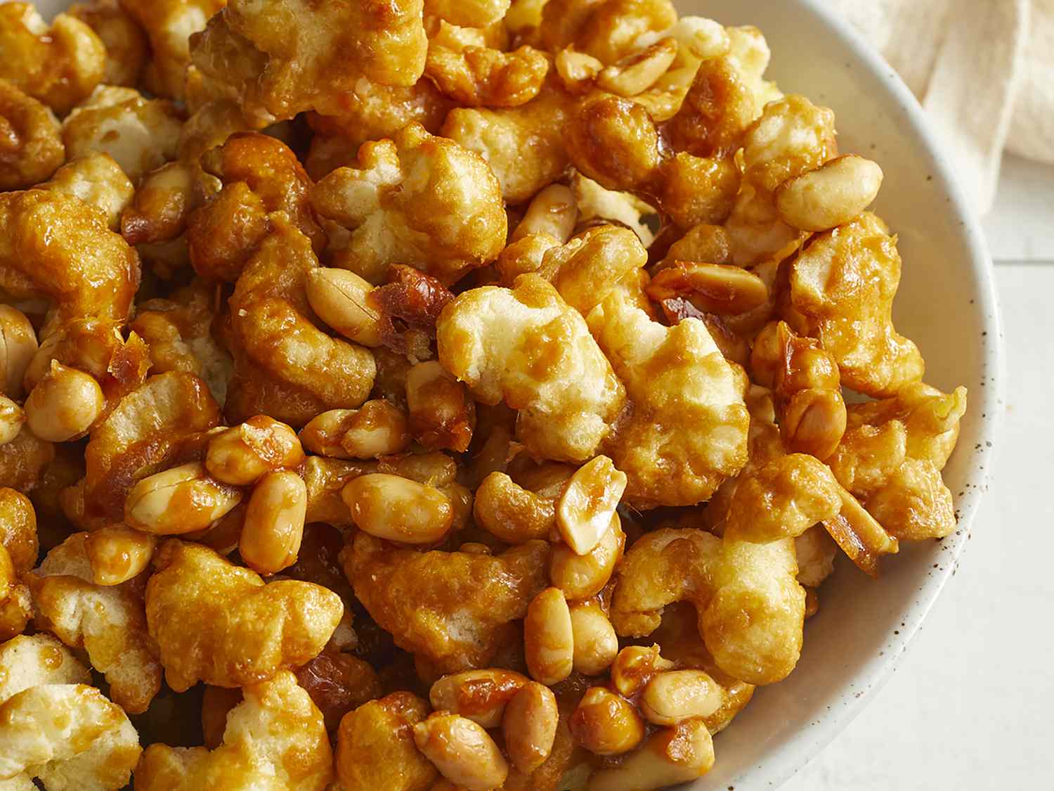 Close up of a bowl of puffed caramel corn