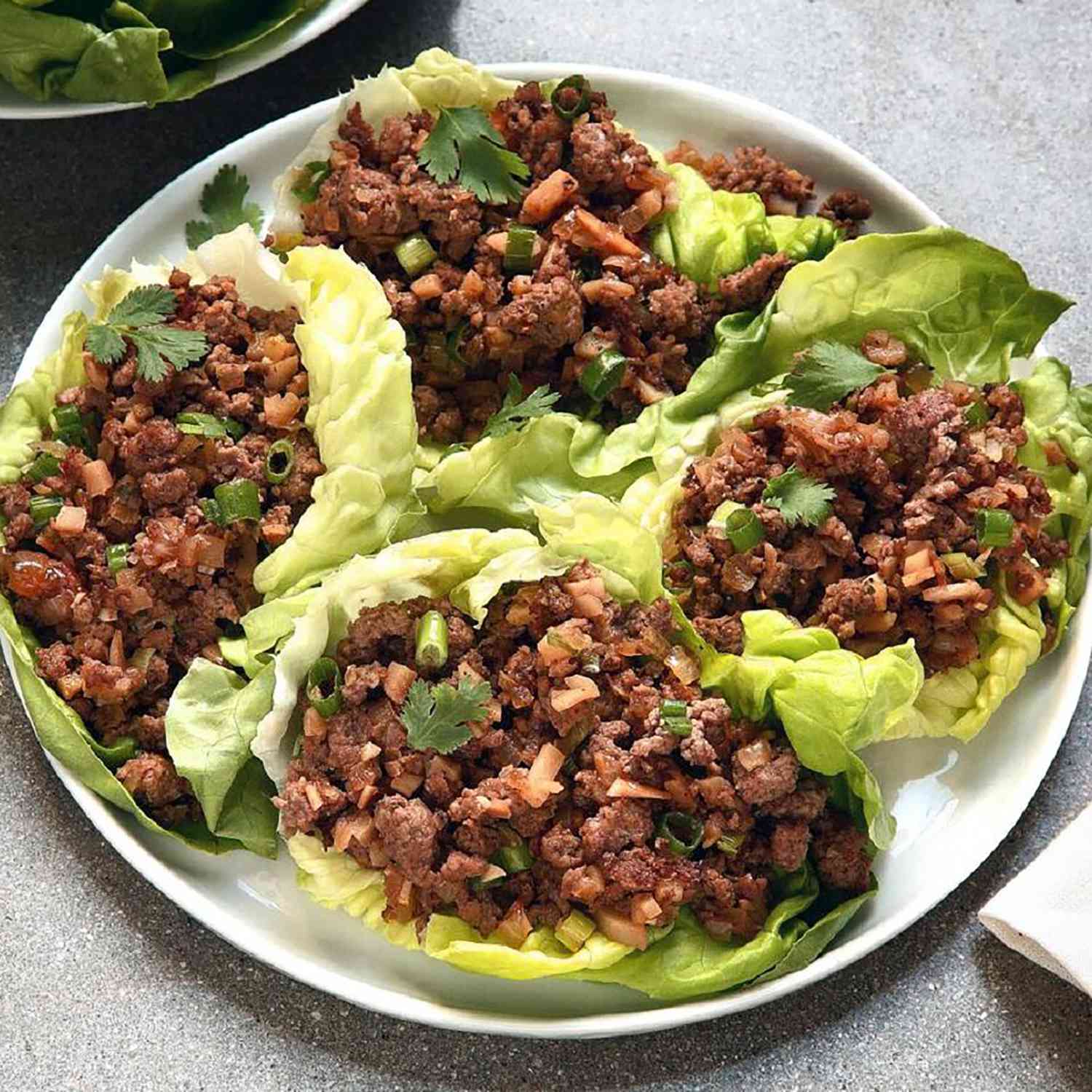Close up view of asian lettuce wraps on on a platter