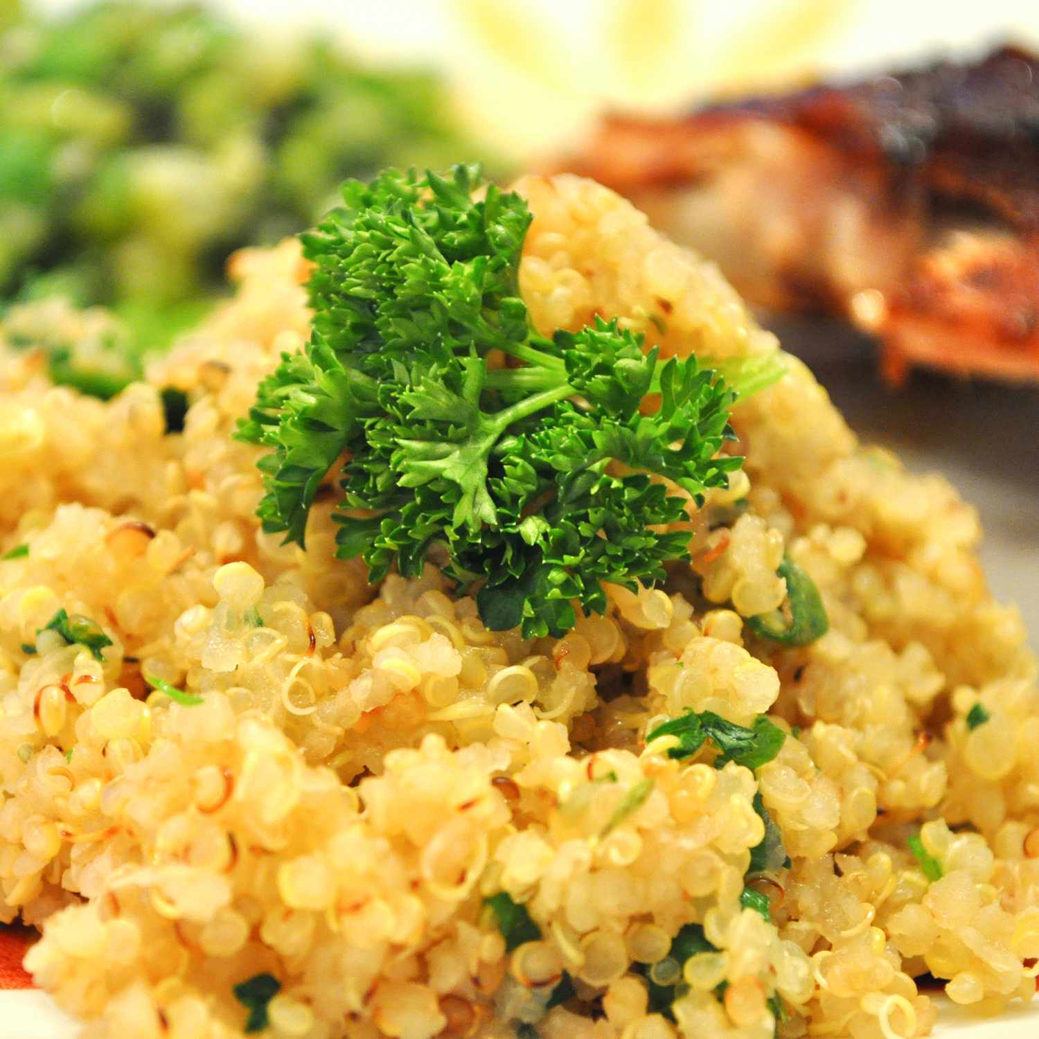 Close up view of a Quinoa Side Dish garnished with fresh herbs