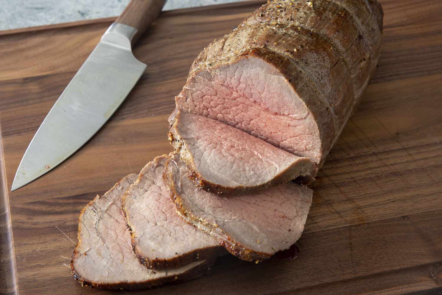 High view of roast beef sliced on a cutting board