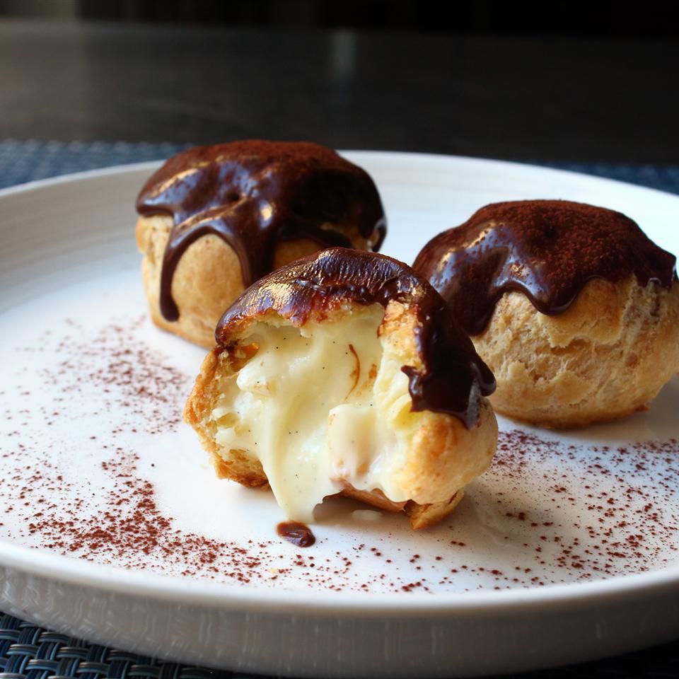 Ganache-topped profiteroles filled with creme patisserie