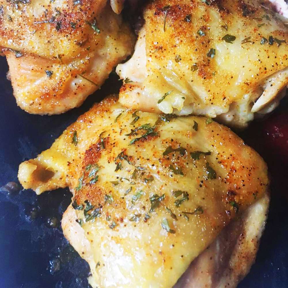 Close up view of Baked Chicken Thighs on a blue plate