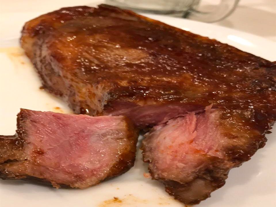 Close up view of BBQ Country-Style Pork Ribs on a white plate