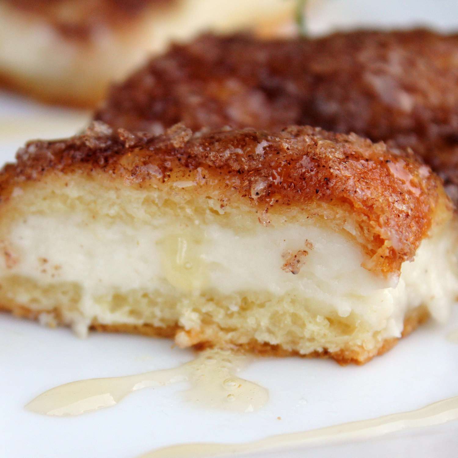 Close up view of Sopapilla Cheesecake Pie slices on a plate