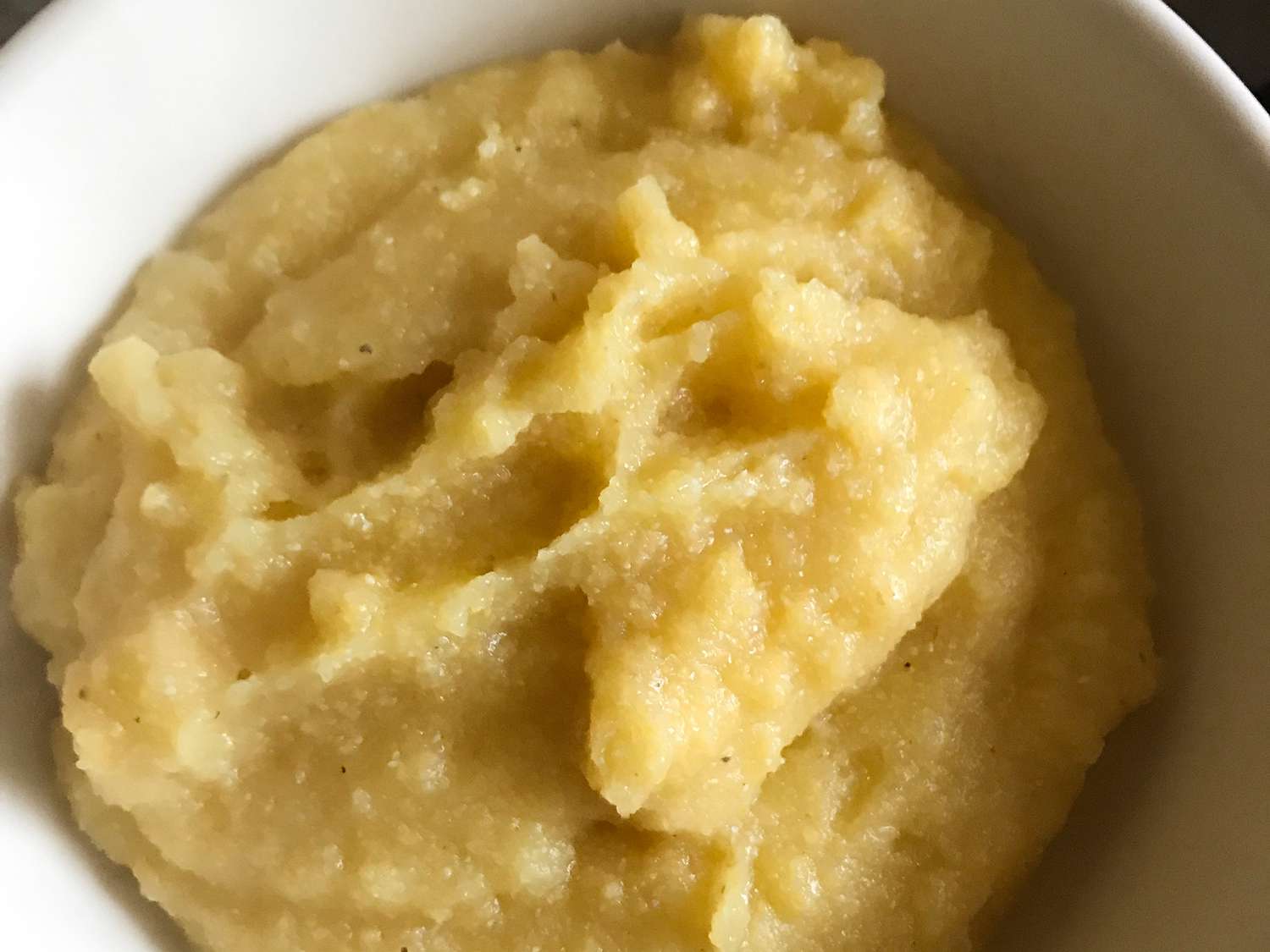 Close up view of Cornmeal Mush in a white bowl