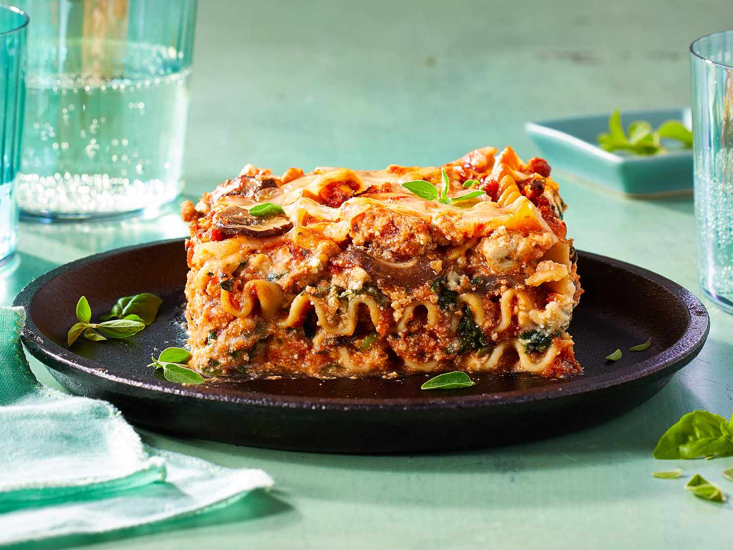 Close up on a large slice of spinach and turkey lasagna