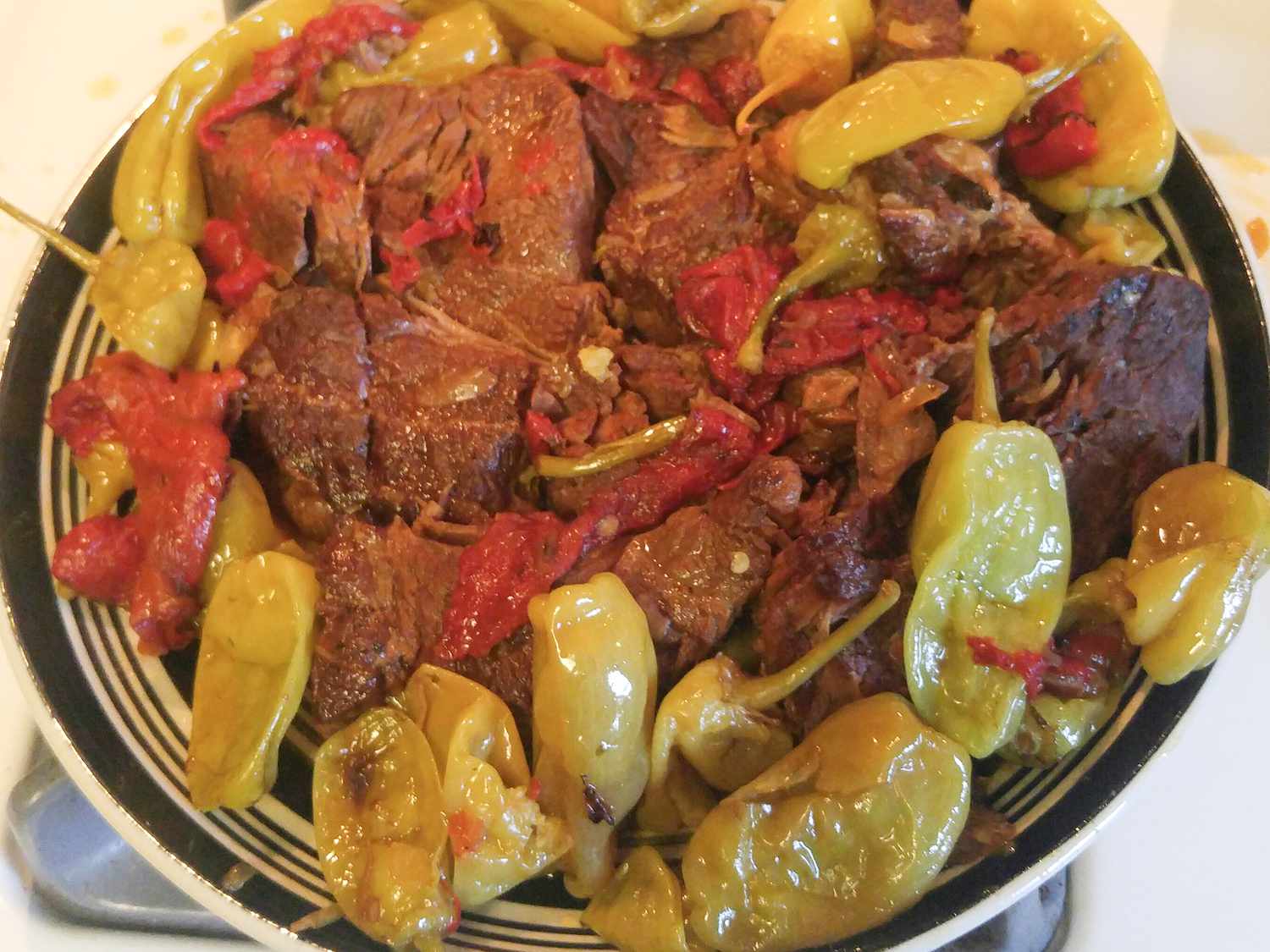 Close up view of a Mississippi Roast with peppers in a bowl