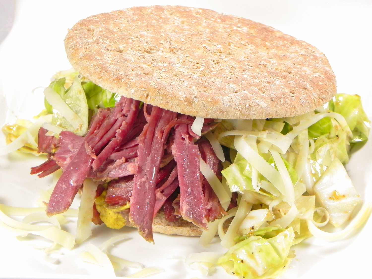 Close up view of an Irish Sandwich with corned beef brisket and lettuce