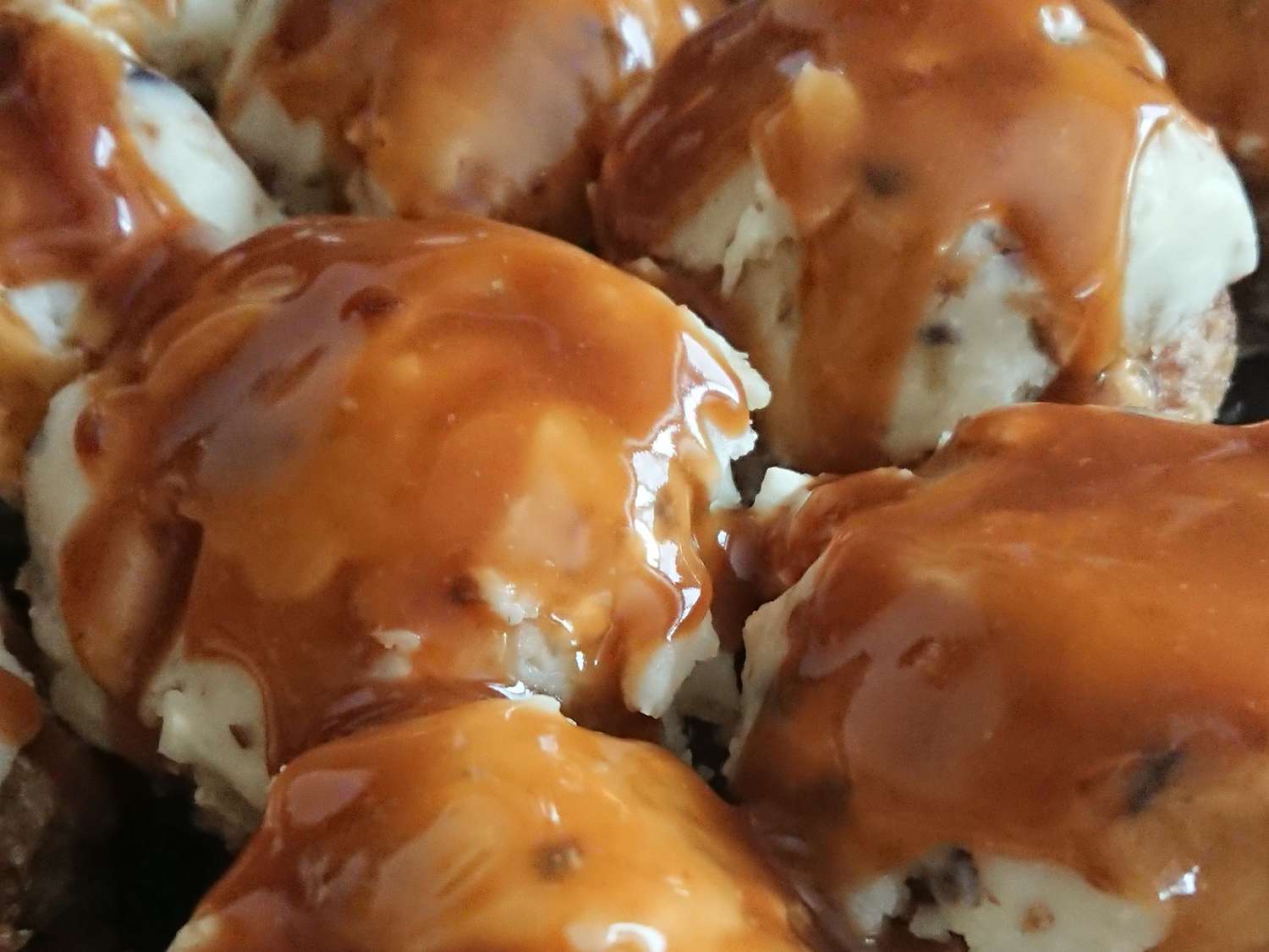 Close up view of Turkey Meatloaf Muffins with gravy