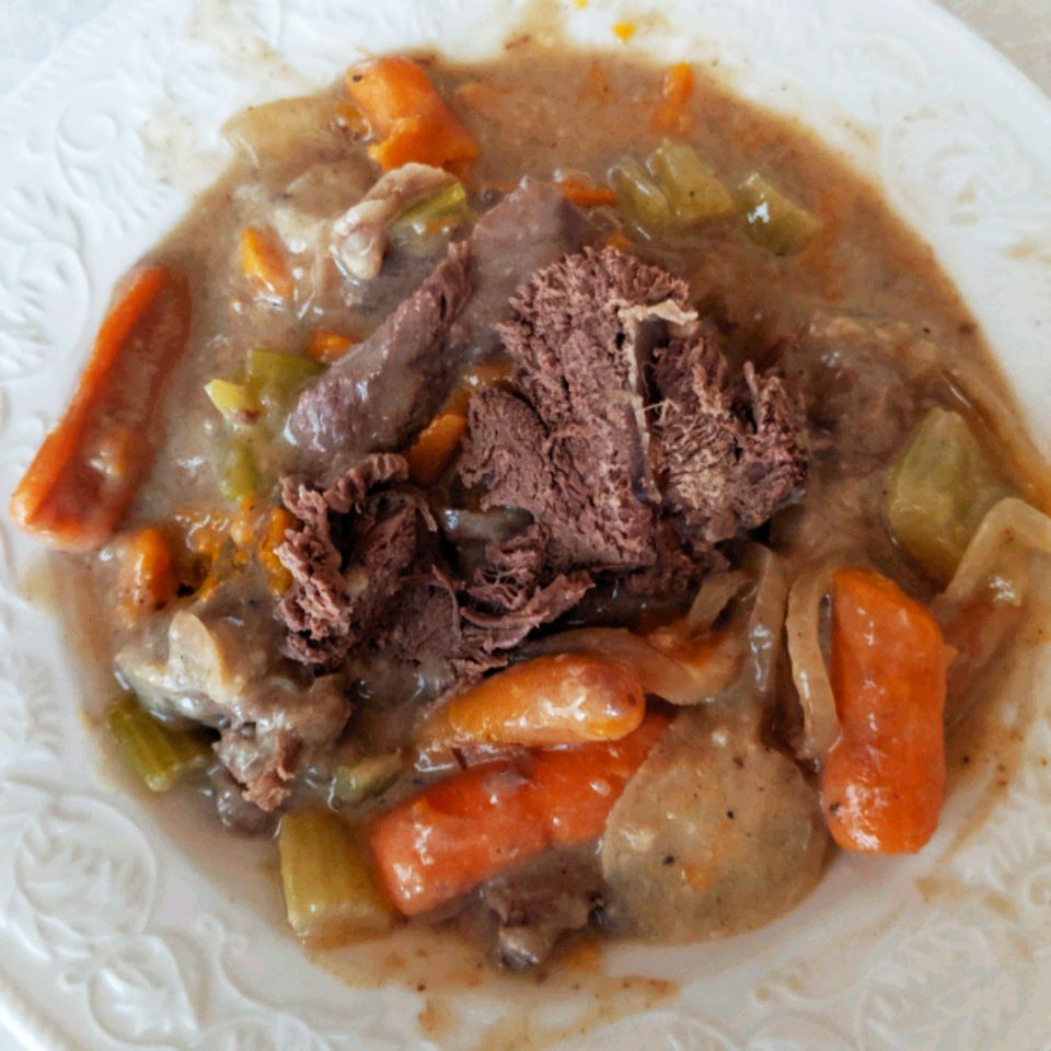 Close up view of Slow Cooker Venison Roast with vegetables in a bowl