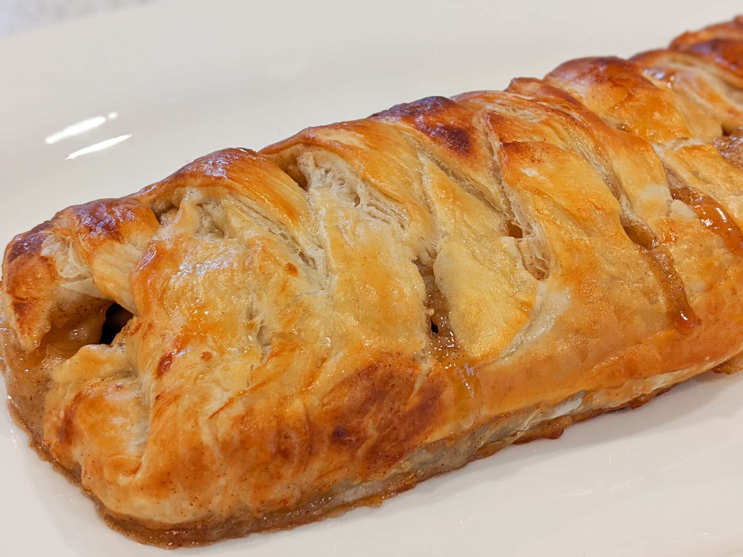 Close up view of Easy Apple Strudel on a white platter 