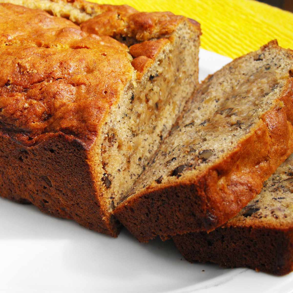 Close up view of sliced Banana Nut Bread on a plate