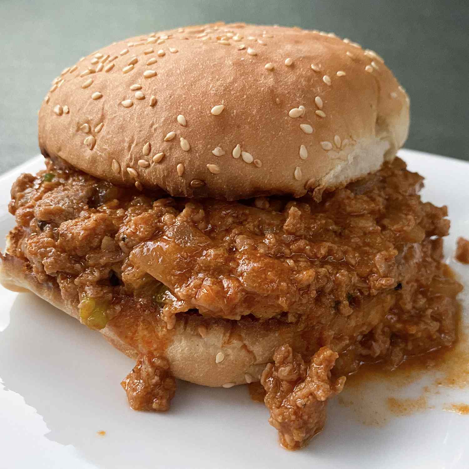 Close up view of a Turkey Sloppy Joes sandwich on a white plate