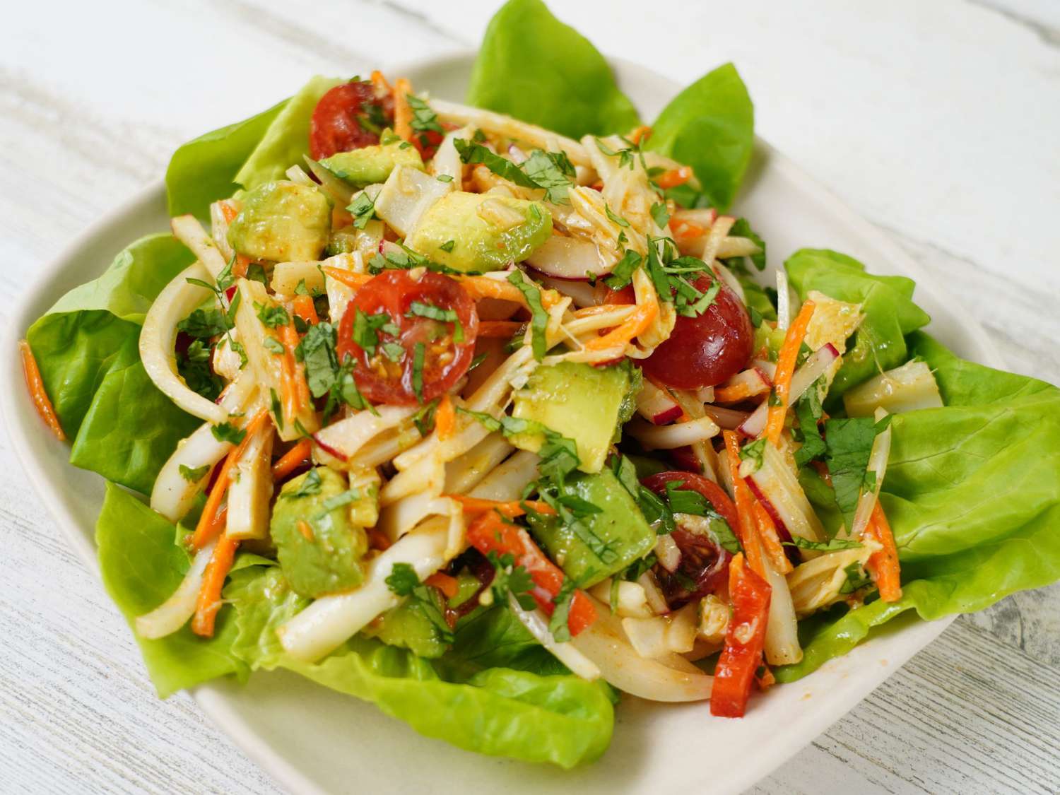 Salad with hearts of palm and avocado on lettuce