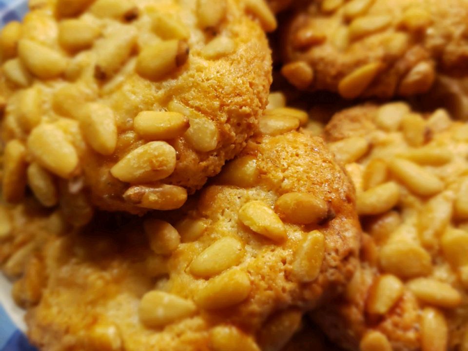 Close up view of a pile of Pignoli Cookies