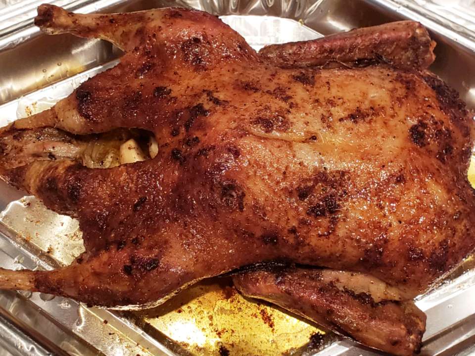 Close up view of Roasted Duck in a roasting pan