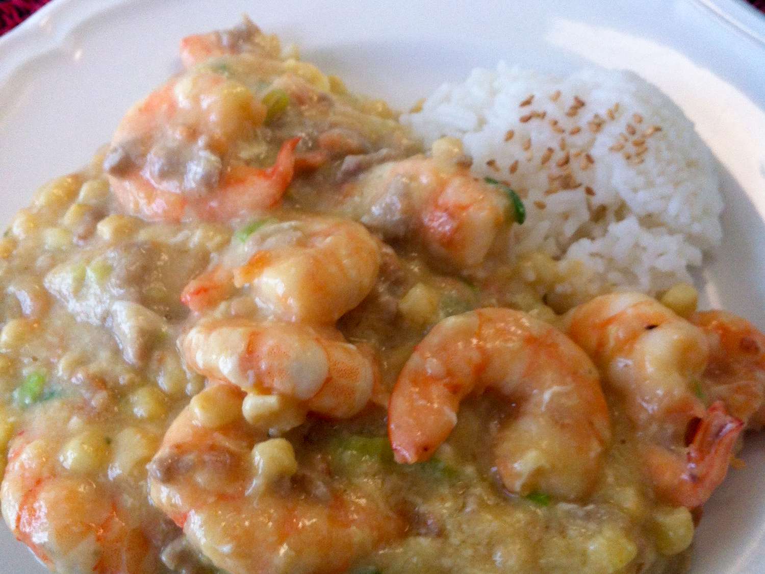 Close up view of Shrimp with Lobster Sauce over white rice on a plate