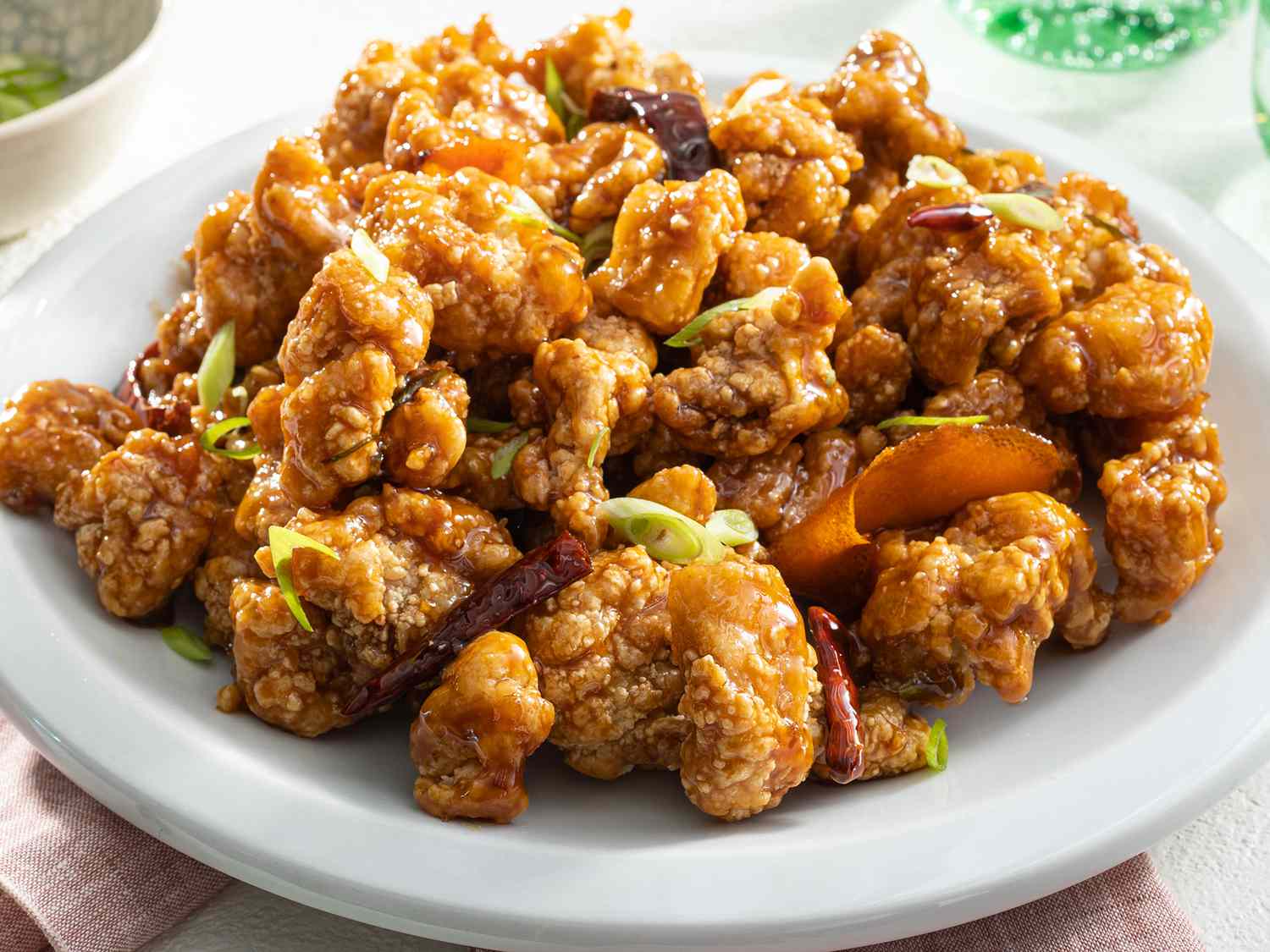 Mid angle, looking into a plate of general tso's chicken