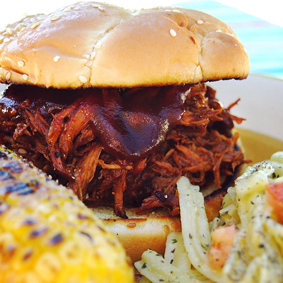 Slow cooker Texas pulled pork sandwich with grilled corn and slaw