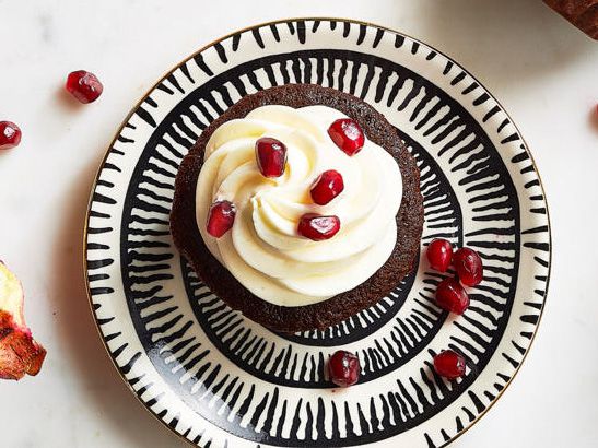 Chocolate cupcakes with pomegranate garnish