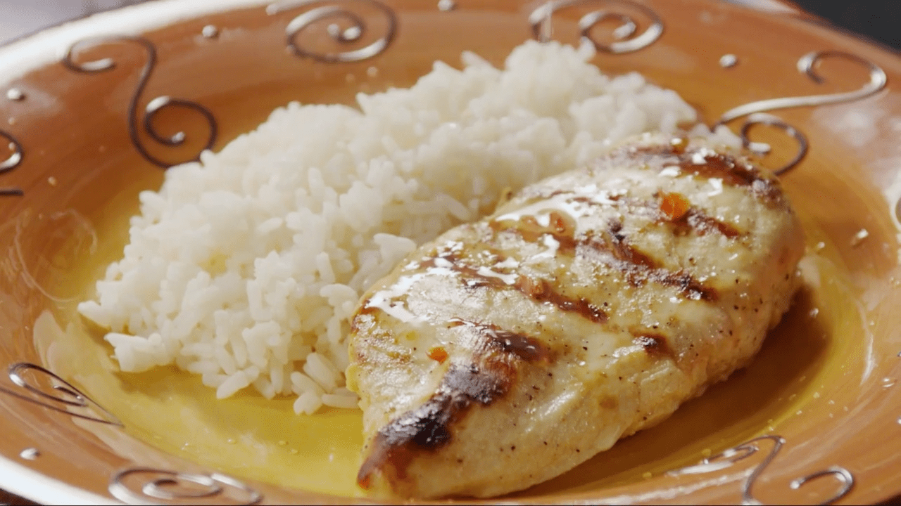 One grilled lemon chicken breast with white rice