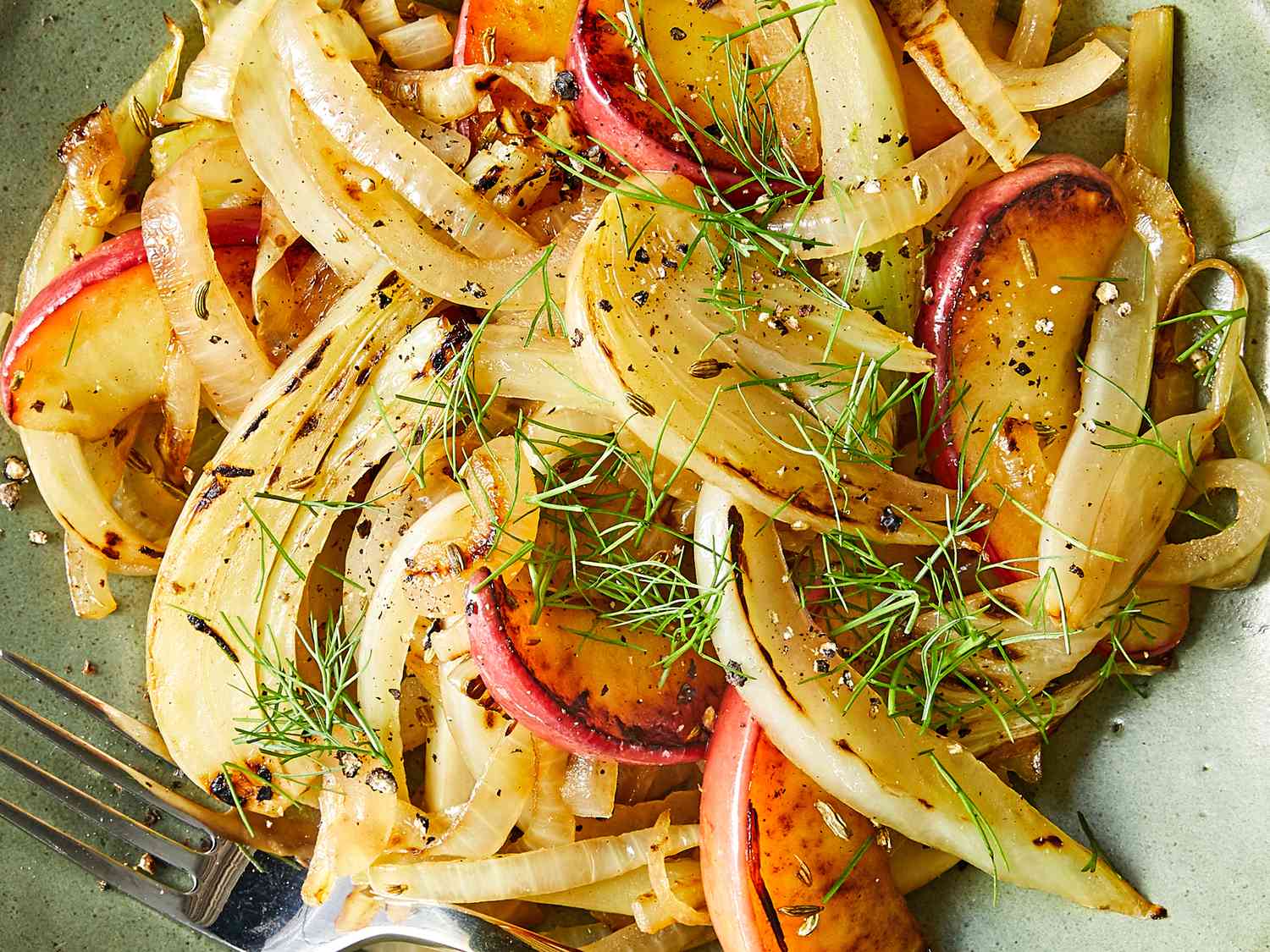 Close up on a bowl of sautéed apple, onion and fennel