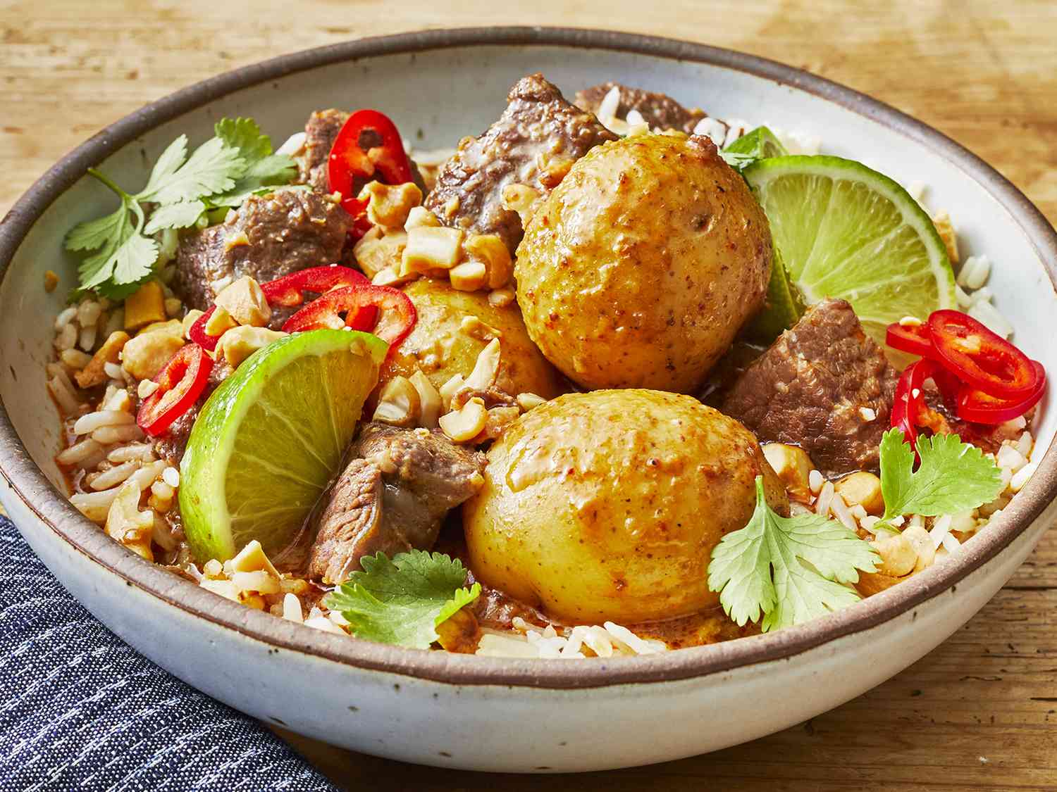 High angle looking at a large bowl of slow cooker beef massaman curry